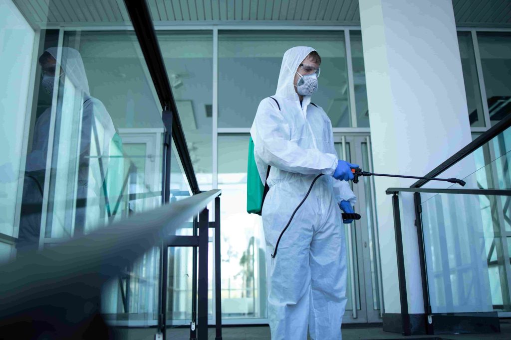 unrecognizable-person-white-protection-suit-disinfecting-public-areas-stop-spreading-highly-contagious-corona-virus